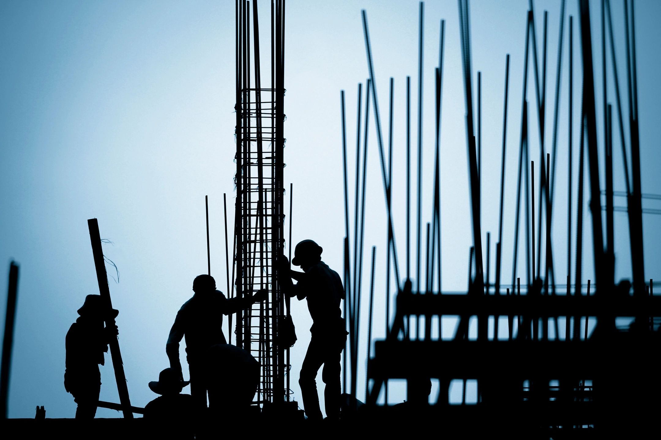 Construction workers with blueprints