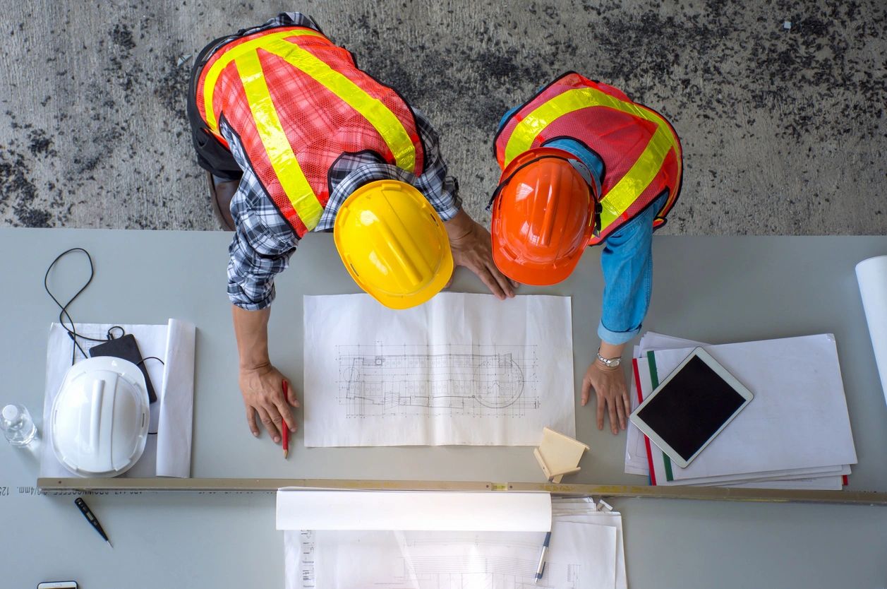 Construction workers blueprints